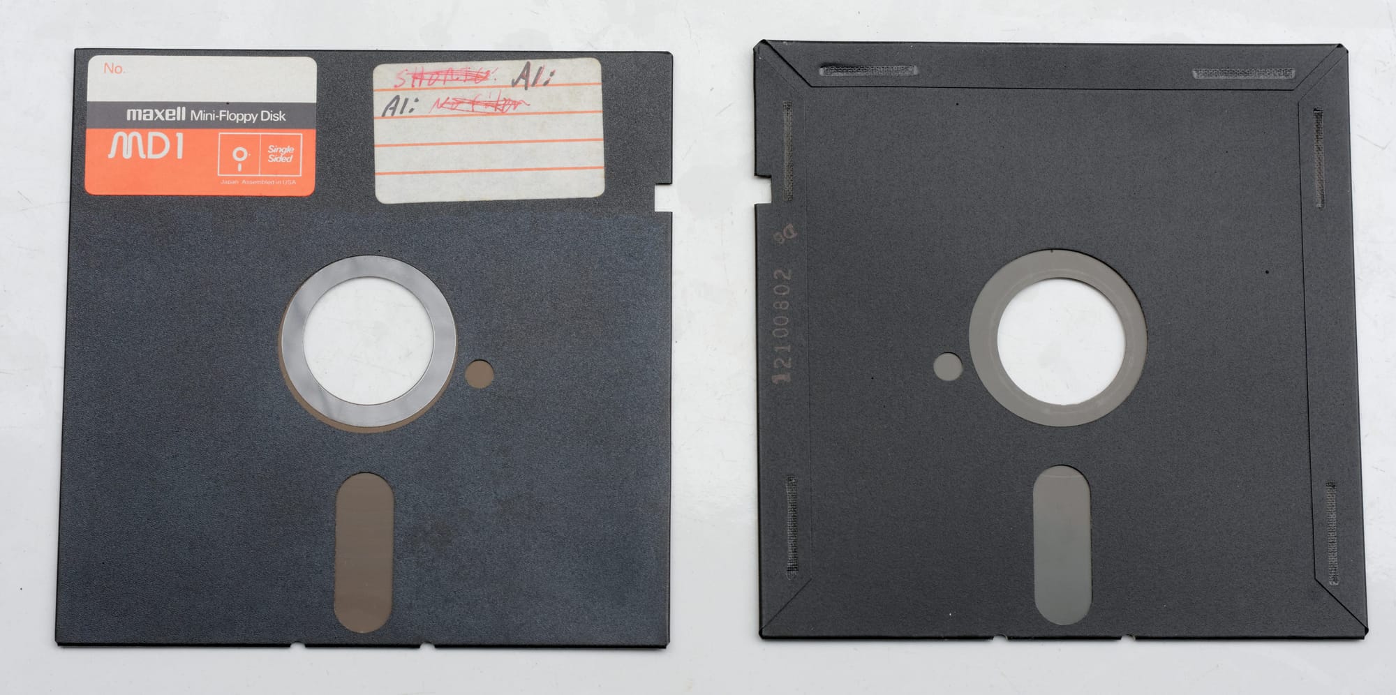 Front and back of a 5 1/4 inch floppy disk